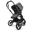 bugaboo cub - wózek dziecięcy 2w1 - wersja spacerowa, tyłem do kierunku jazdy - widok pod skosem - kolor forest green (zielony)